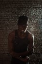 Black man in the rain on the wall background Royalty Free Stock Photo