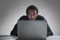 Black man reading from his laptop screen Royalty Free Stock Photo