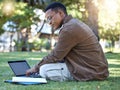 Black man reading, park and student laptop work in a garden with a education book and lens flare, Outdoor, happiness and