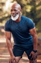 Black man, running break and breathing for fitness, exercise and workout in nature, park or garden. Senior male, sports Royalty Free Stock Photo