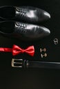 Black man`s shoes, cufflinks, wedding rings, a black belt and a Royalty Free Stock Photo