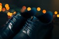 Black man`s shoes with laces. Against background bokeh. Royalty Free Stock Photo