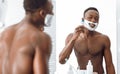 Black Man Shaving Face With Razor And Foam In Bathroom Royalty Free Stock Photo