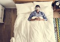 Black man sleeping on bed with eye mask Royalty Free Stock Photo