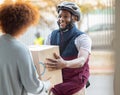 Black man, smile and delivery with box for woman at house for logistics, cargo and safety. Young african courier Royalty Free Stock Photo
