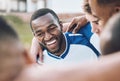 Black man, soccer team and football athlete outdoor in group hug before sports game on field. Sport training, teamwork Royalty Free Stock Photo