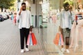 Black man talking on mobile phone holding shopping bag Royalty Free Stock Photo