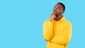 Black Man Thinking Touching Chin Looking Aside, Blue Background, Panorama Royalty Free Stock Photo