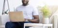 Black man typing text or programming code on laptop Royalty Free Stock Photo