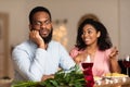 Black Man On Unsuccessful First Date In Restaurant Royalty Free Stock Photo