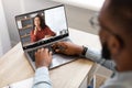 Black Man Using Laptop Computer For Online English Lessons With Female Tutor Royalty Free Stock Photo