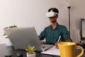 Black Man Wearing VR Glasses at Remote Job