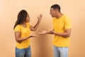 Black man and woman shouting at each other, fighting, looking at each other and yelling Royalty Free Stock Photo