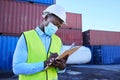 Black man working in covid with face mask, shipping container in supply chain industry and logistics stock inventory