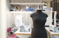 mannequin standing in a sewing studio background jobs. Creation of fashion clothes. Sewing concept