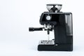 Black manual coffee maker with grinder on a white background, side view