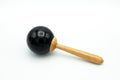 A black maracas lying on a white underground Royalty Free Stock Photo