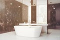 Black marble bathroom, sink, tub, side toned Royalty Free Stock Photo