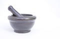 Black marble pestle and mortar on white background on left Royalty Free Stock Photo