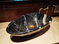 Black marble sink and faucet in bathroom, washroom, toilet. Royalty Free Stock Photo