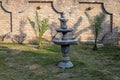 Black marble stone fountain in the garden Royalty Free Stock Photo
