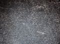 Black marble with white veins and splashes, intense close-up of polished stone