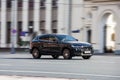 Black Maserati Levante car moving on the street. Overspeed in city concept. SUV car on city road in motion, front side view Royalty Free Stock Photo