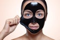 A black mask to the face of a beautiful woman. Royalty Free Stock Photo