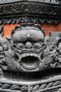 Black masks made of concrete at the temple's entrance in Nusa Dua, Bali, Indonesia