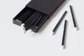 Black matches in matchbox on white background Royalty Free Stock Photo