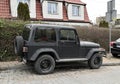 Black matte classic vintage look American car Jeep Wrangler parked Royalty Free Stock Photo