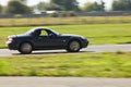 Black Mazda car sideview-aug27 Royalty Free Stock Photo