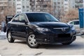 Black Mazda 3 2008 year front view with dark gray interior in excellent condition in a parking space among other cars