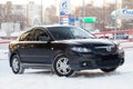 Black Mazda 3 2008 year front view with dark gray interior in excellent condition in a parking space among other cars