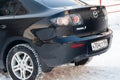 Black Mazda 3 2008 year rear view with dark gray interior in excellent condition in a parking space among other cars