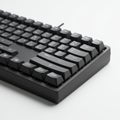 Black mechanical keyboard with high-profile keys on a plain white background. Features Royalty Free Stock Photo