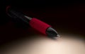 Black mechanical pencil with red soft grip