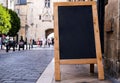 Black menu board on a street in the center of european city Royalty Free Stock Photo