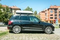 Black Mercedes Benz CLK 4x4 SUV car parked on the street in the city