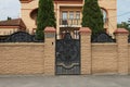 Black metal door with an iron wrought iron pattern and sharp rods Royalty Free Stock Photo