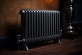 black metal heating radiator mounted on brown wall inside a room. Royalty Free Stock Photo