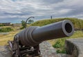 Black metal historic cannon, Suomenlinna Fortress, Helsinki, Finland Royalty Free Stock Photo