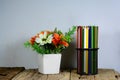 black metal pencil case and white vase on old wooden table Royalty Free Stock Photo