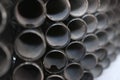 Black metal pipes for gasification or water supply. Industrial background close up Royalty Free Stock Photo