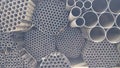 Black metal pipes of various sizes arranged randomly Royalty Free Stock Photo