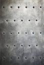 Black metal plate or armour texture with rivets Royalty Free Stock Photo