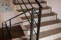 Black metal railings on the porch of the house. Black and white close up of interior stairs of downtown building. iron railings Royalty Free Stock Photo