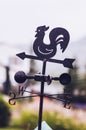 Black metal Rooster weather vane weathercock silhouette, we Royalty Free Stock Photo