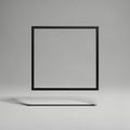 With a black metal square frame, suspended and casting a shadow on a Royalty Free Stock Photo