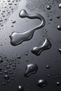 Black metal water drops on dark reflective surface Royalty Free Stock Photo